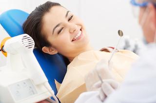 wisdom teeth extractions medina | A woman smiles in the dental chair