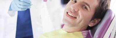 Man getting a dental check-up | Sinick Family Dental