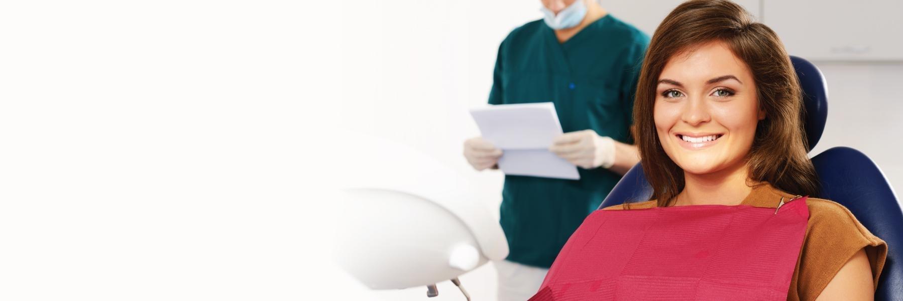 Woman smiling in dentist's office in Medina Ohio