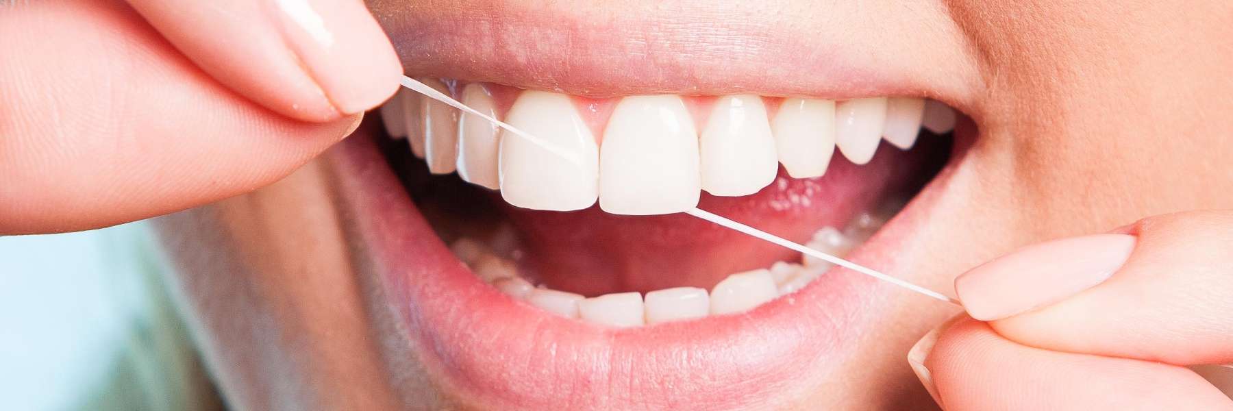 Close-up of a person flossing