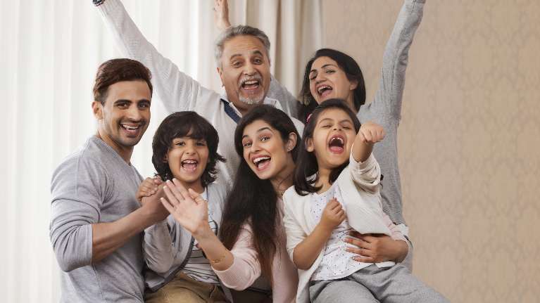 Smiling children with family, trusting the top pediatric dentist in Medina.
